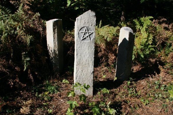 Carved standing stone garden markers