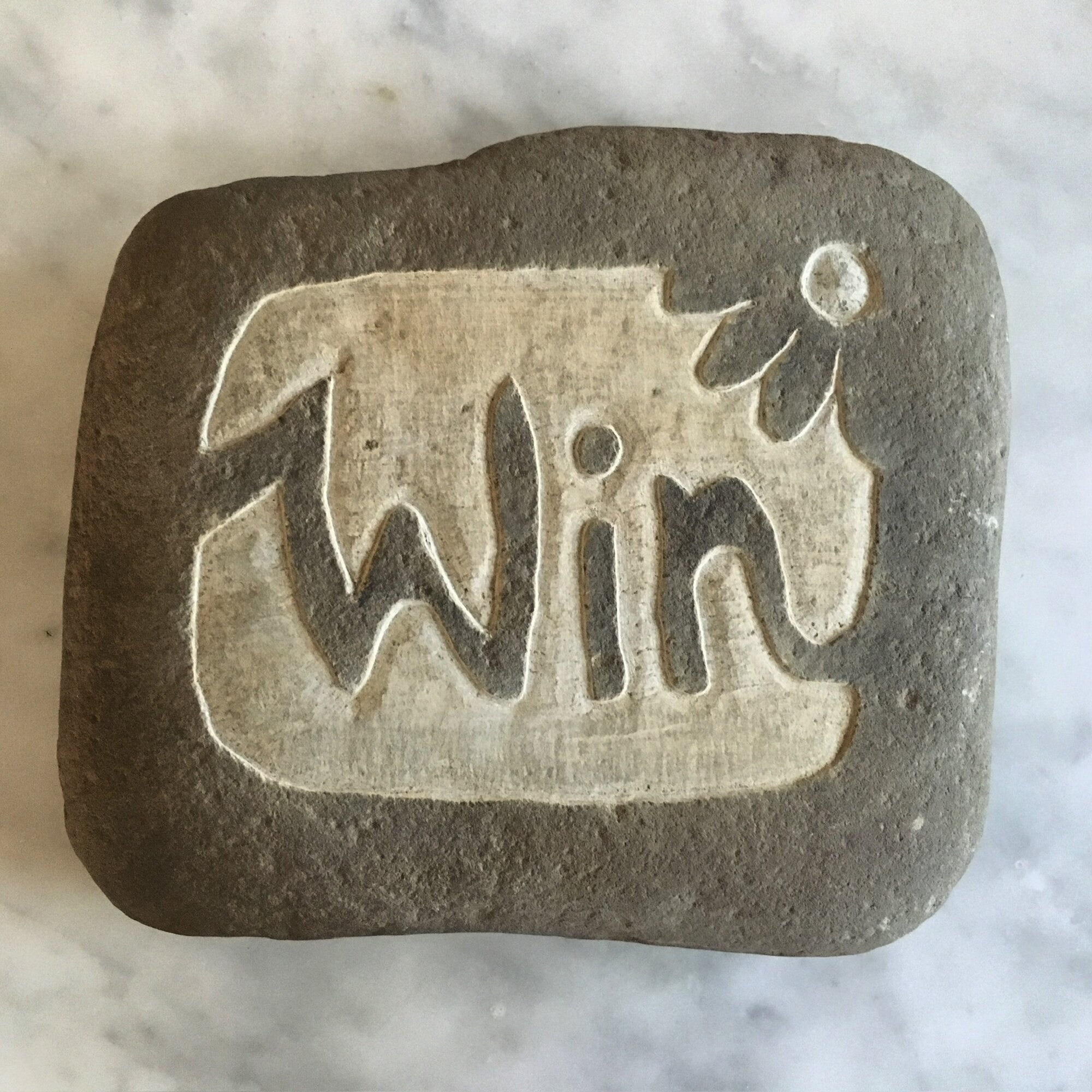 Carved stone name plaque reading Twin