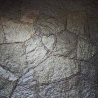 Heart carved into flagstone paving