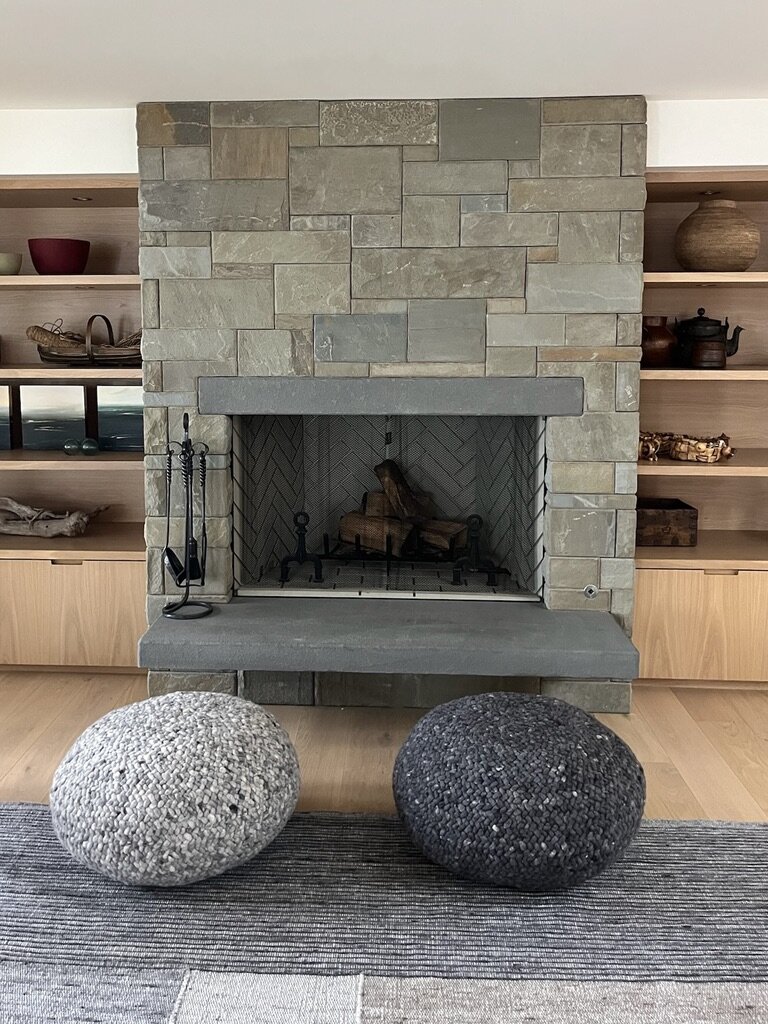 Modern slate fireplace with a herringbone-tiled firebox