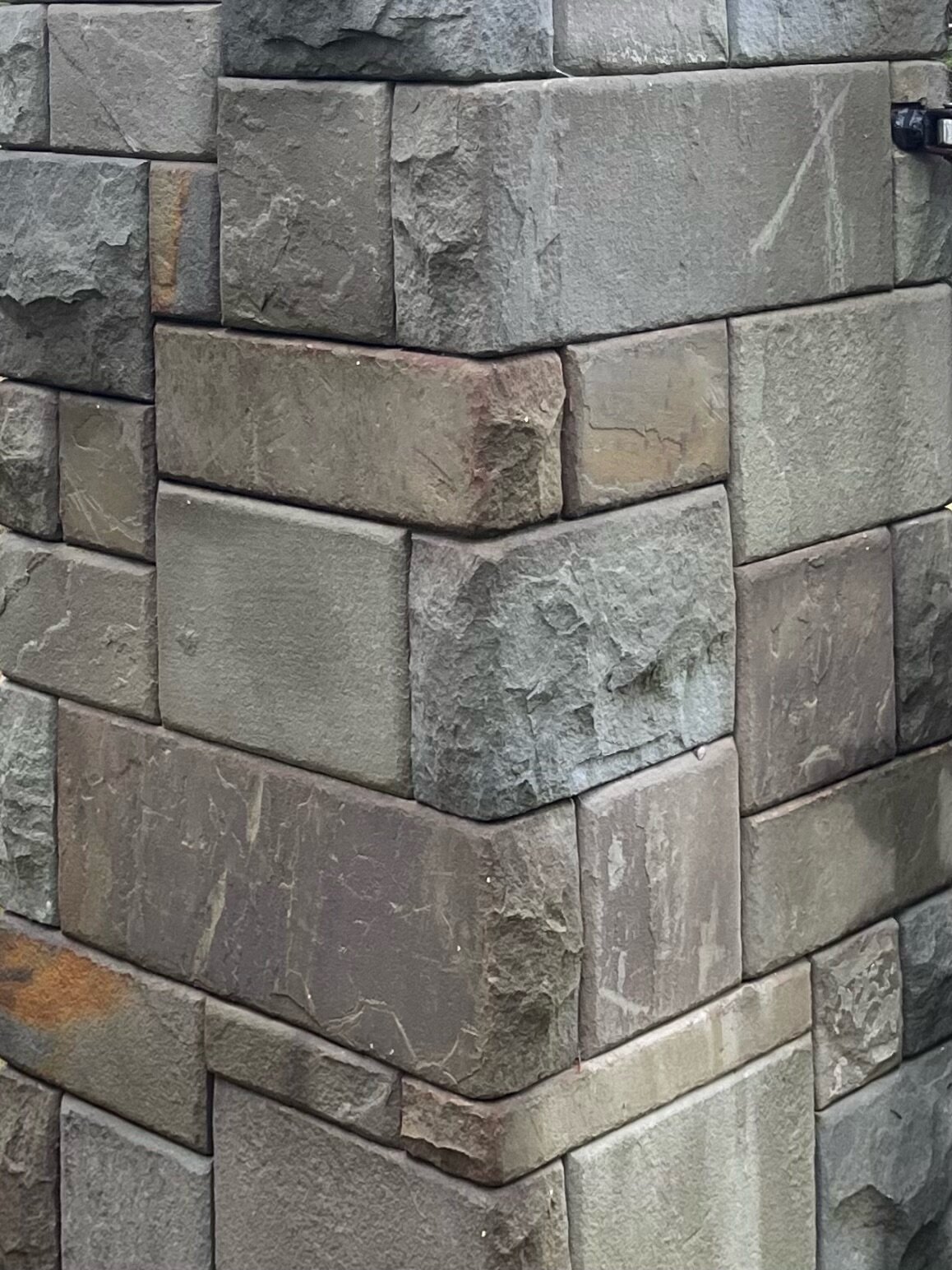 Driveway gate pillar in dry-stack stone