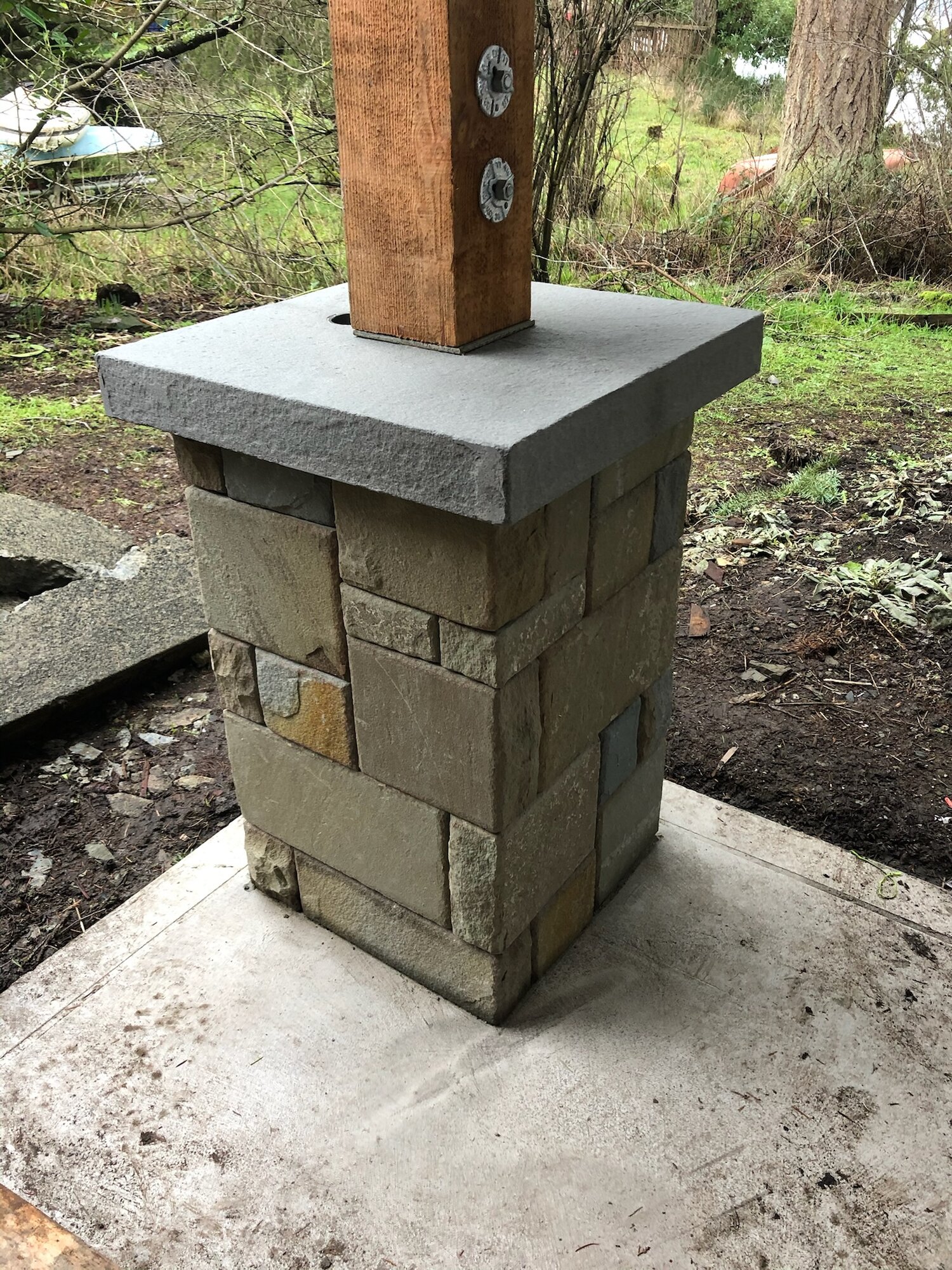 Stone-clad post base with a bluestone cap