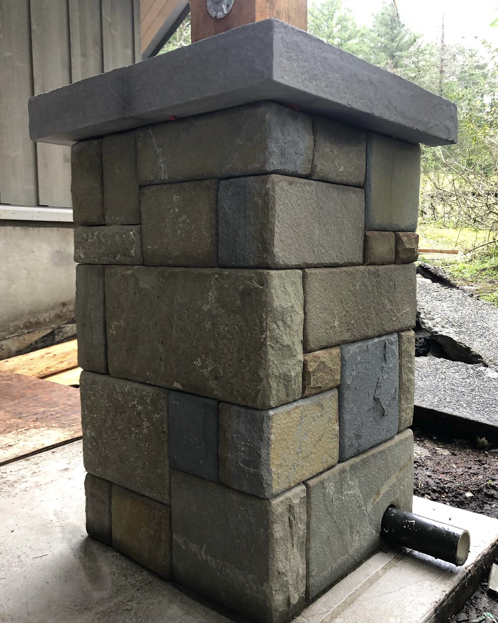 Stone-clad post base, side view
