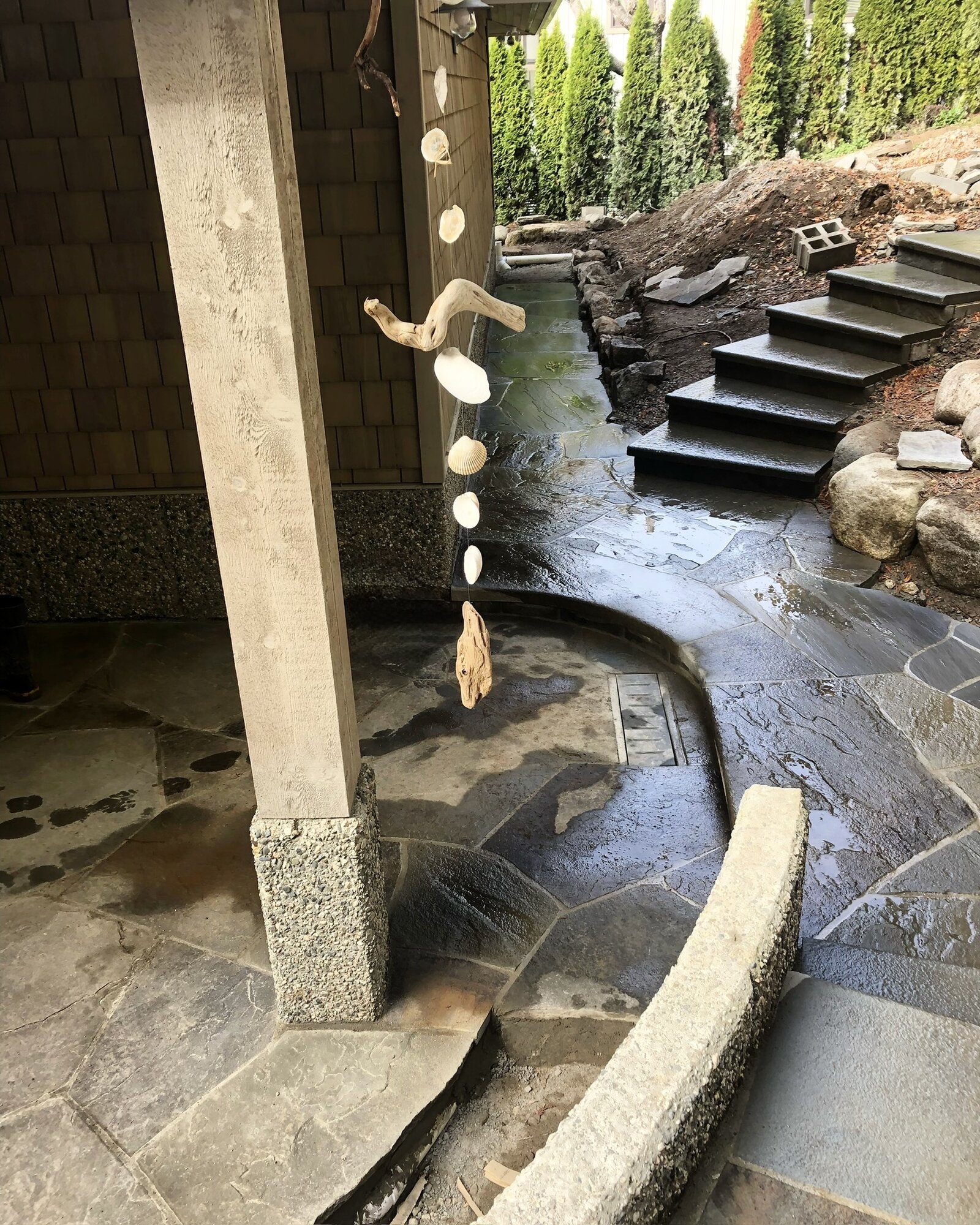Curved flagstone walkway leading to garden steps