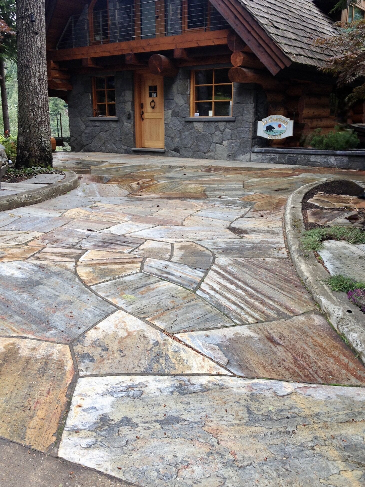 Flagstone driveway entrance at a log cabin