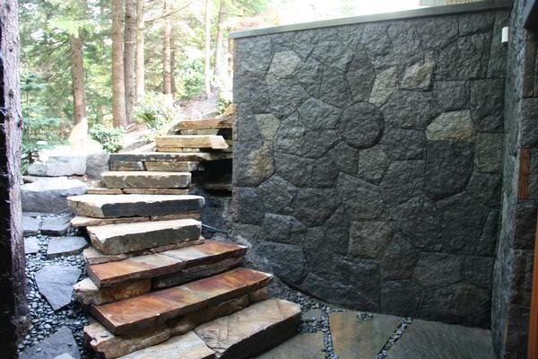 Stone steps beside a pebble medallion wall detail